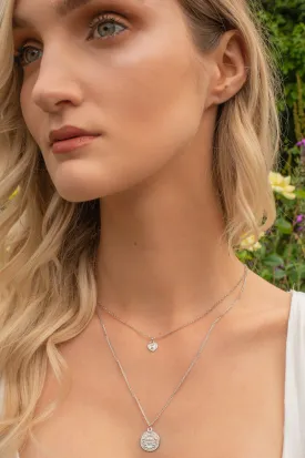 Sterling silver two strand layering necklace with coin and heart charm.